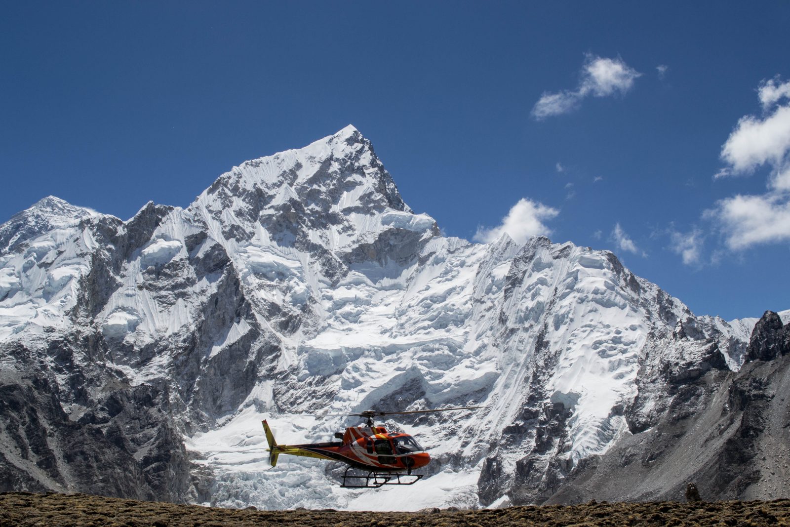 A helicopter leaving Everest Base Camp